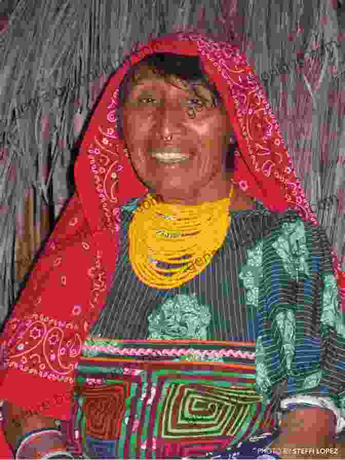 A Vibrant Image Of A Kuna Woman In Traditional Attire, Surrounded By Lush Greenery. VOYAGE TO THE SAN BLAS ISLANDS: MEETING WITH THE KUNA INDIANS